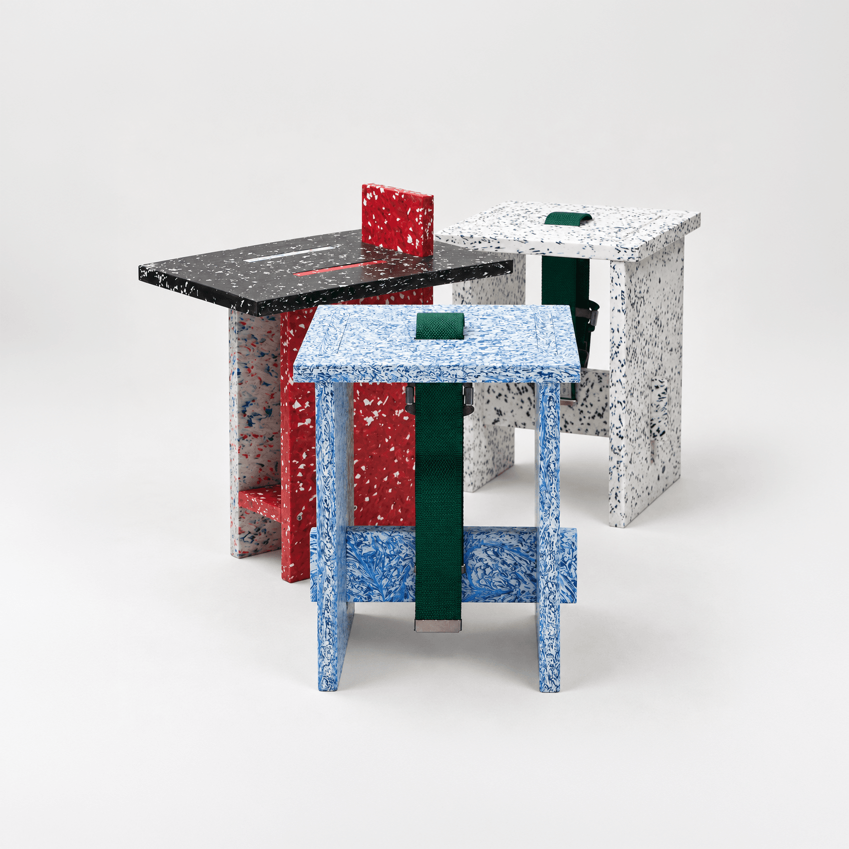 Speckled recycled-plastic stools in blue, red, black and white