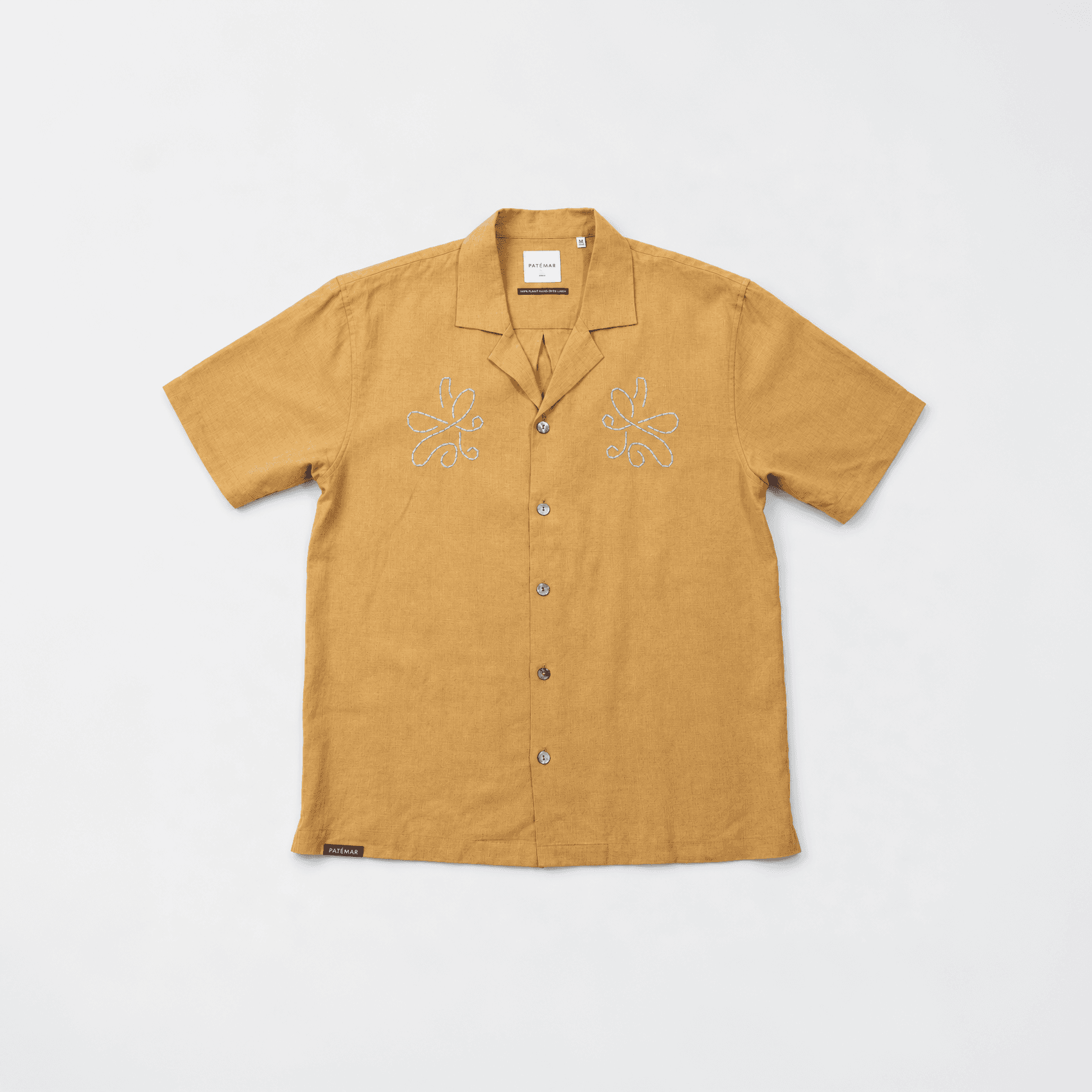 Mustard short-sleeved shirt with embroidery on the chest