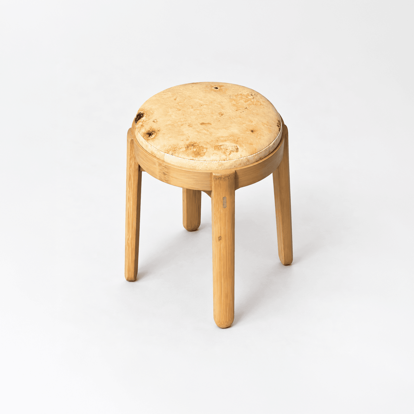 Round wooden stool with a burl-pattern seat
